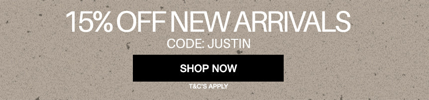 Promotional banner with the text '15% OFF NEW ARRIVALS', 'CODE: JUSTIN', and a black 'SHOP NOW' button on a textured light gray background.