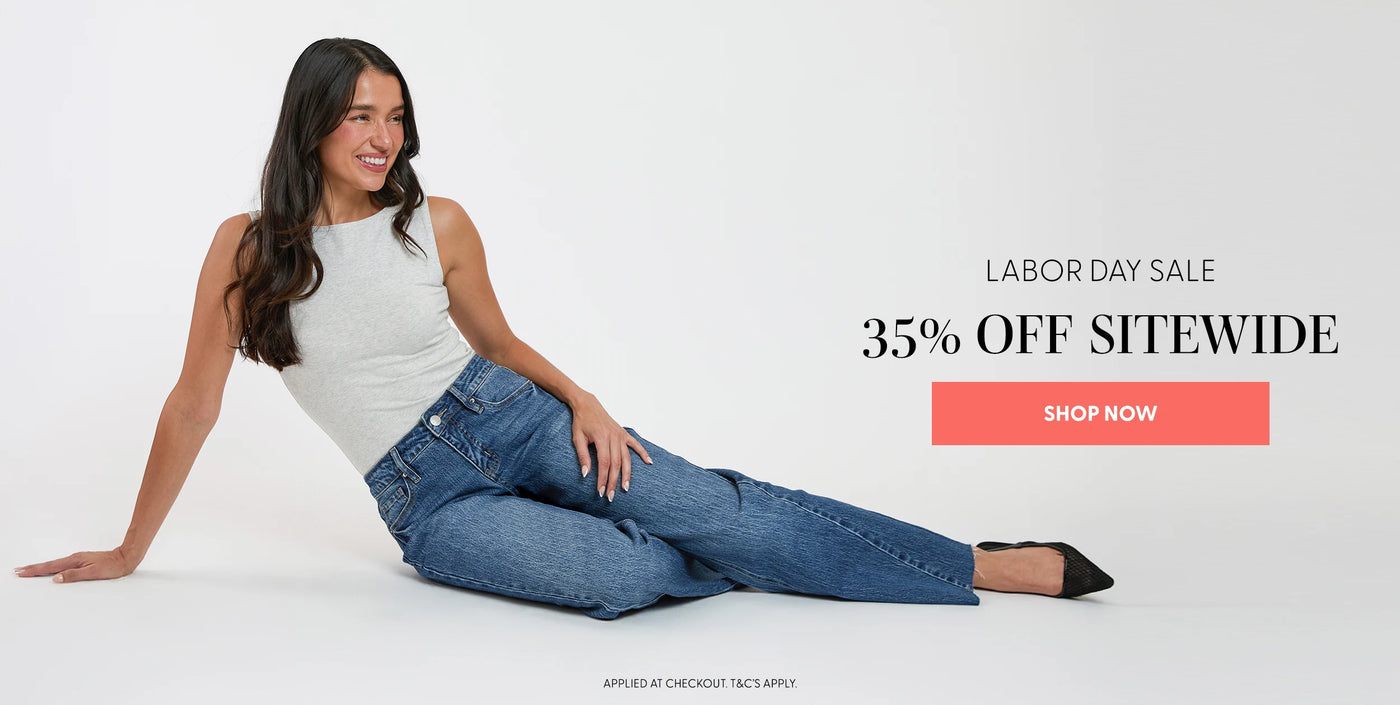 Woman sitting on a white background wearing blue jeans with Labor Day sale text and promotional button.