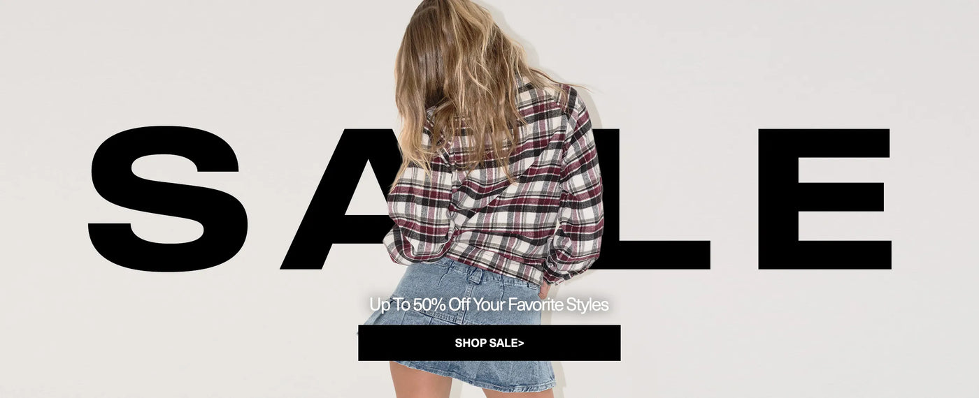 Person wearing a plaid shirt with 'SALE' text and promotional message on a white background